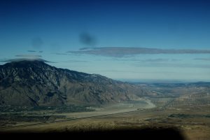 wind turbines under a mountain pass